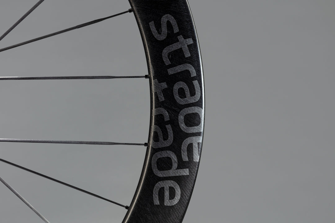 Carbon or steel? The truth about spokes, and why we build the way we do